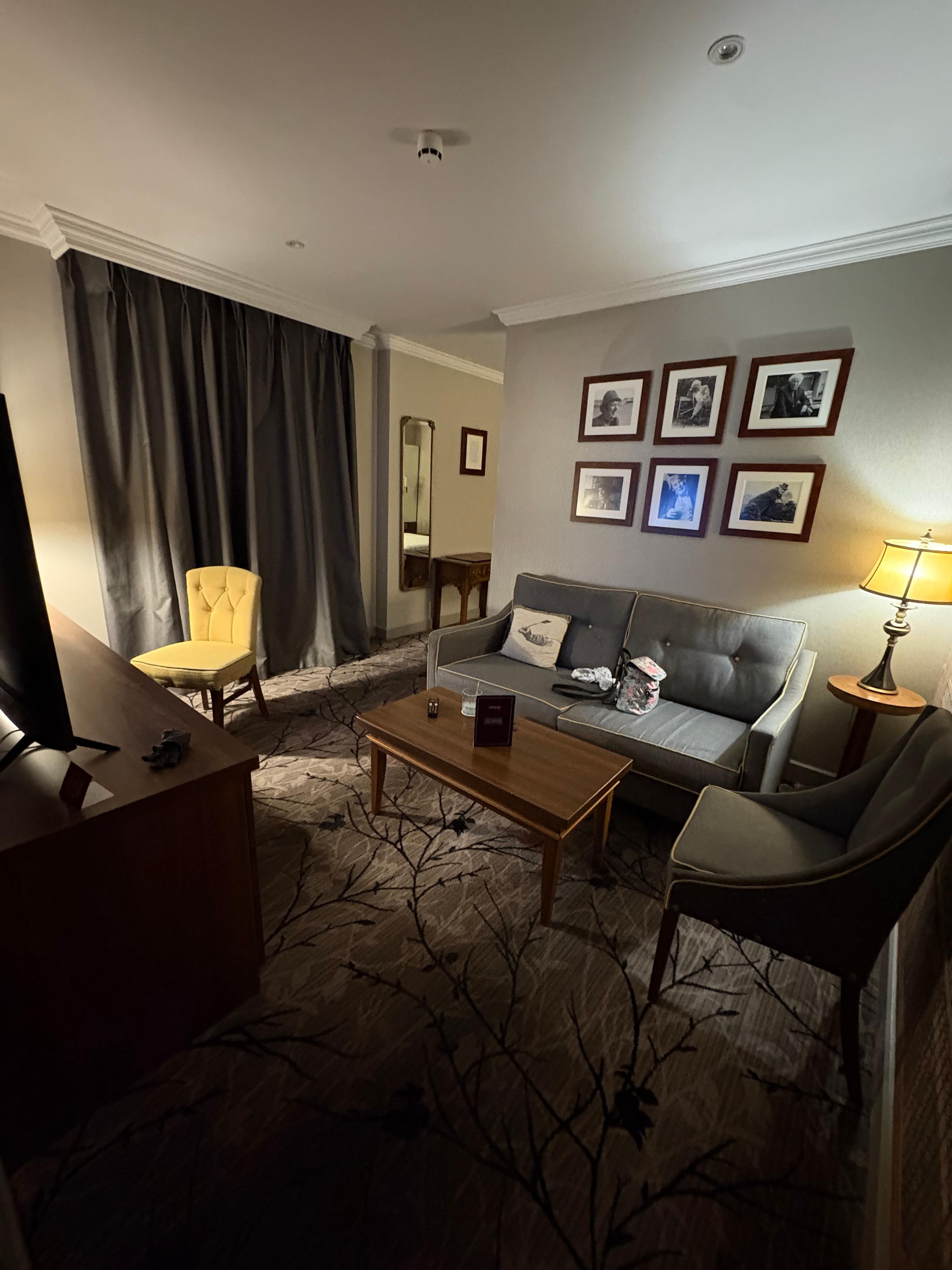 Left side tv & fridge in desk with nice chair