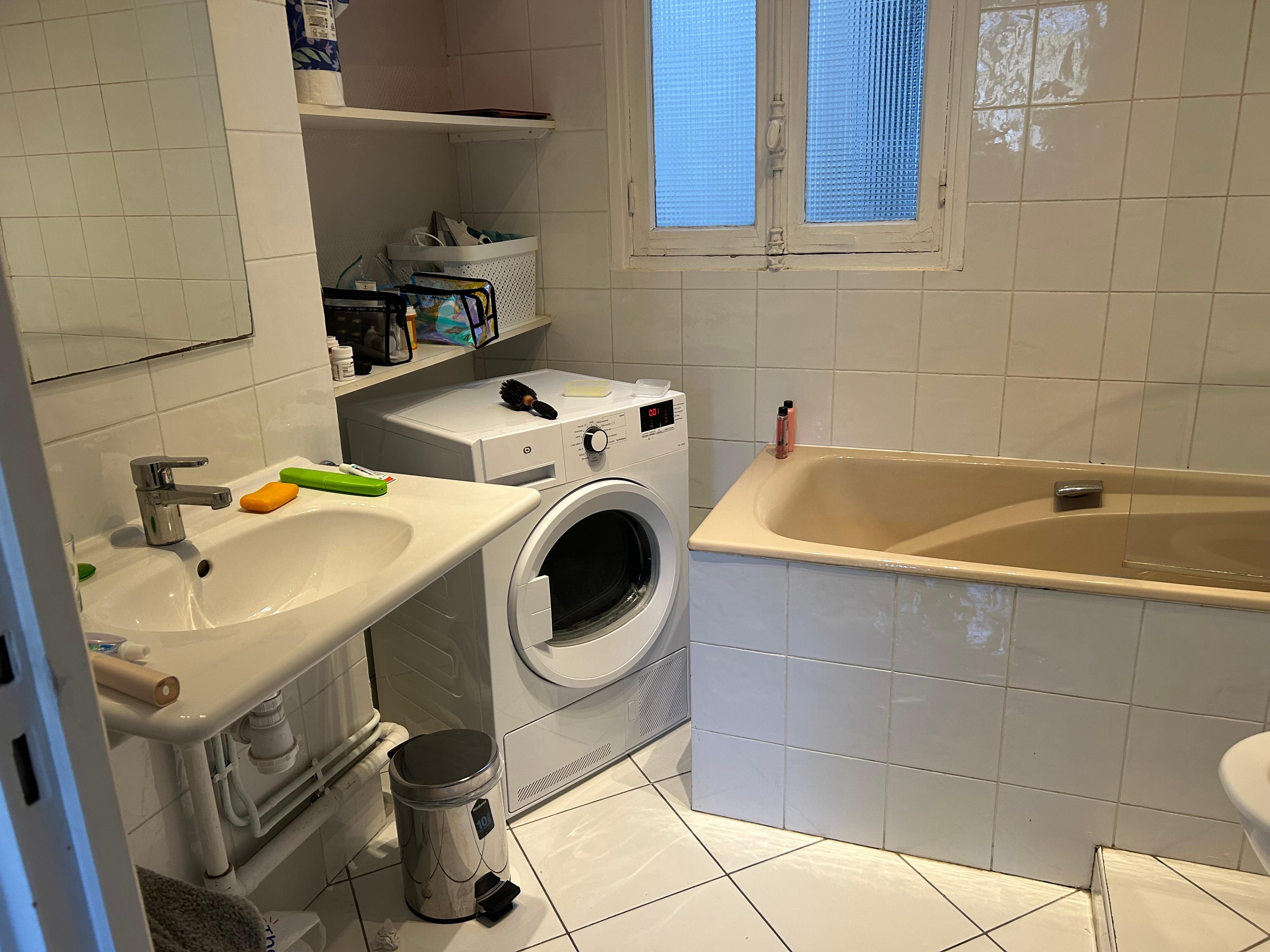 Great bathroom with washer and dryer
