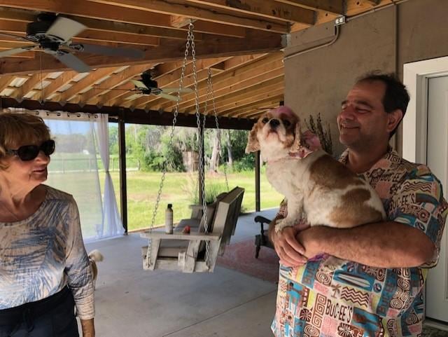 Baby Maggie enjoys the Veranda with Dad and Grandma