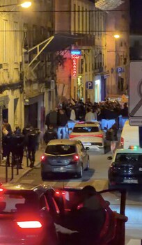 People having a brawl in front of the apartment