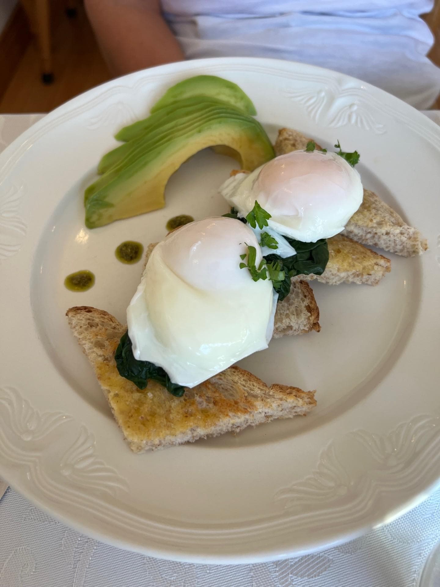 Breakfast, egg on toast with avocado.