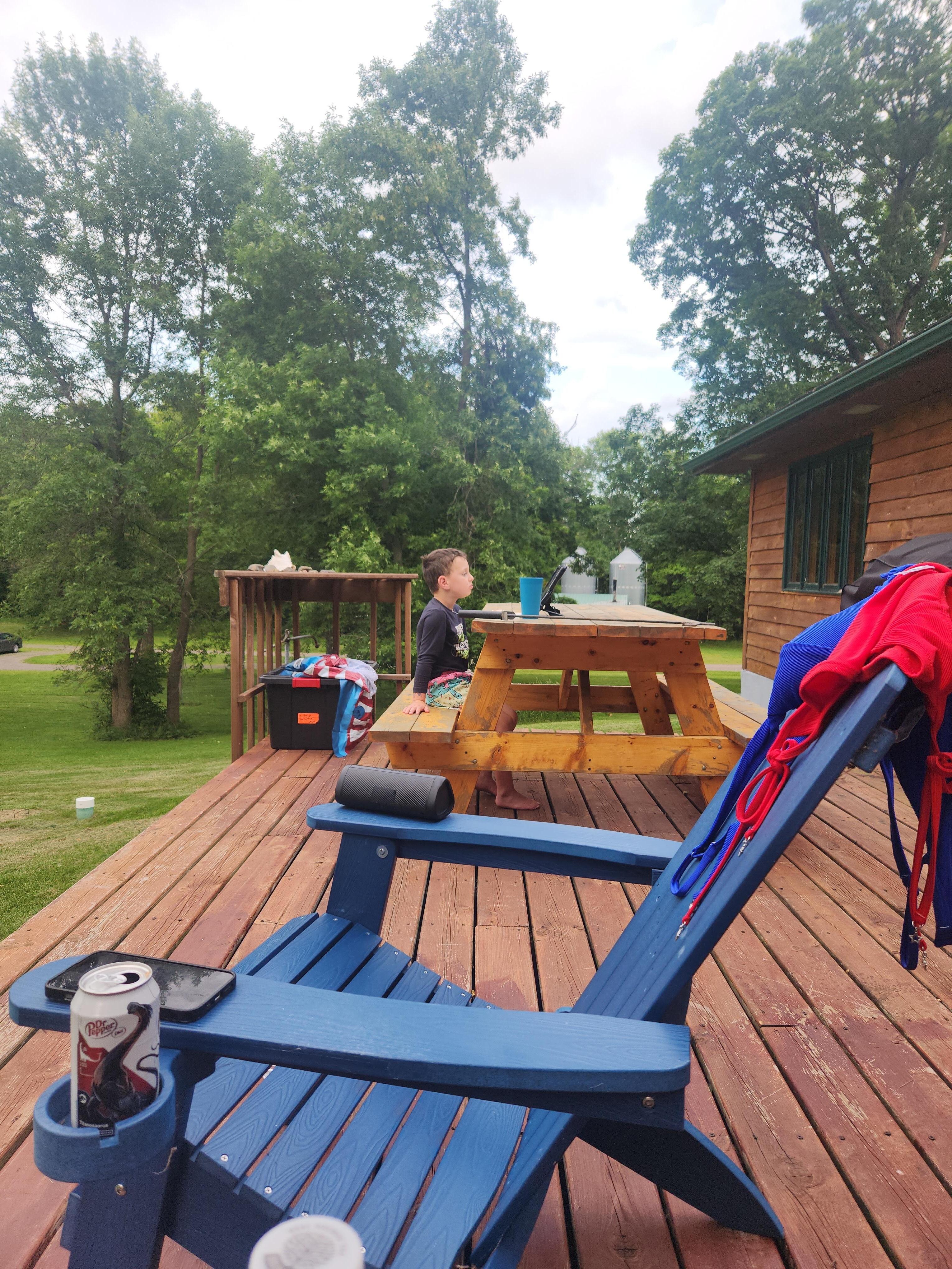 My grandson having a snack on the deck!