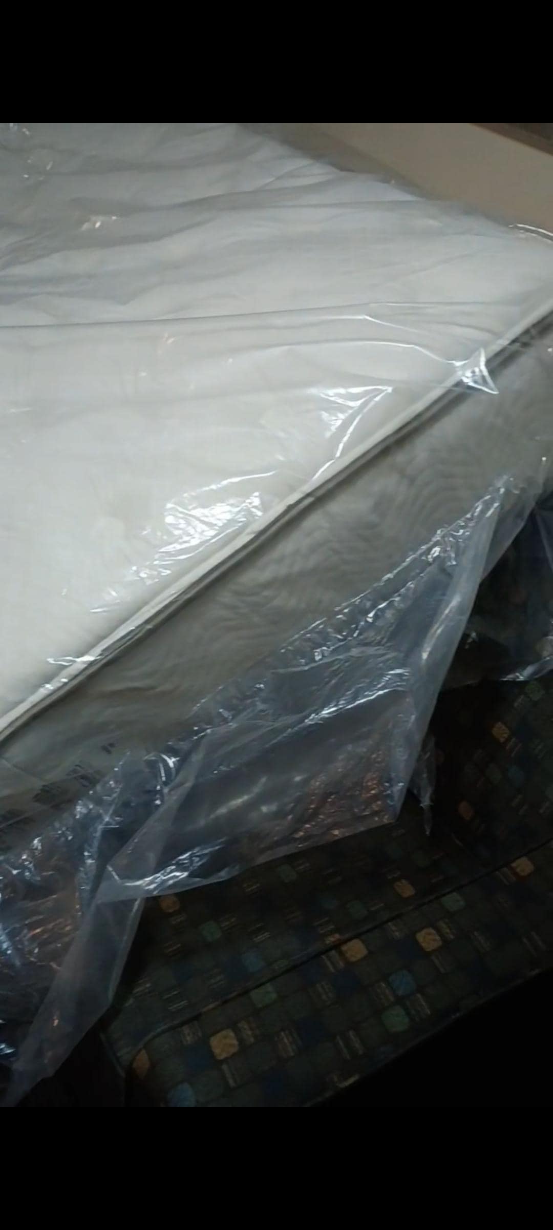 Extra mattress sitting on chair 