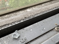 Some of the glass from the broken window