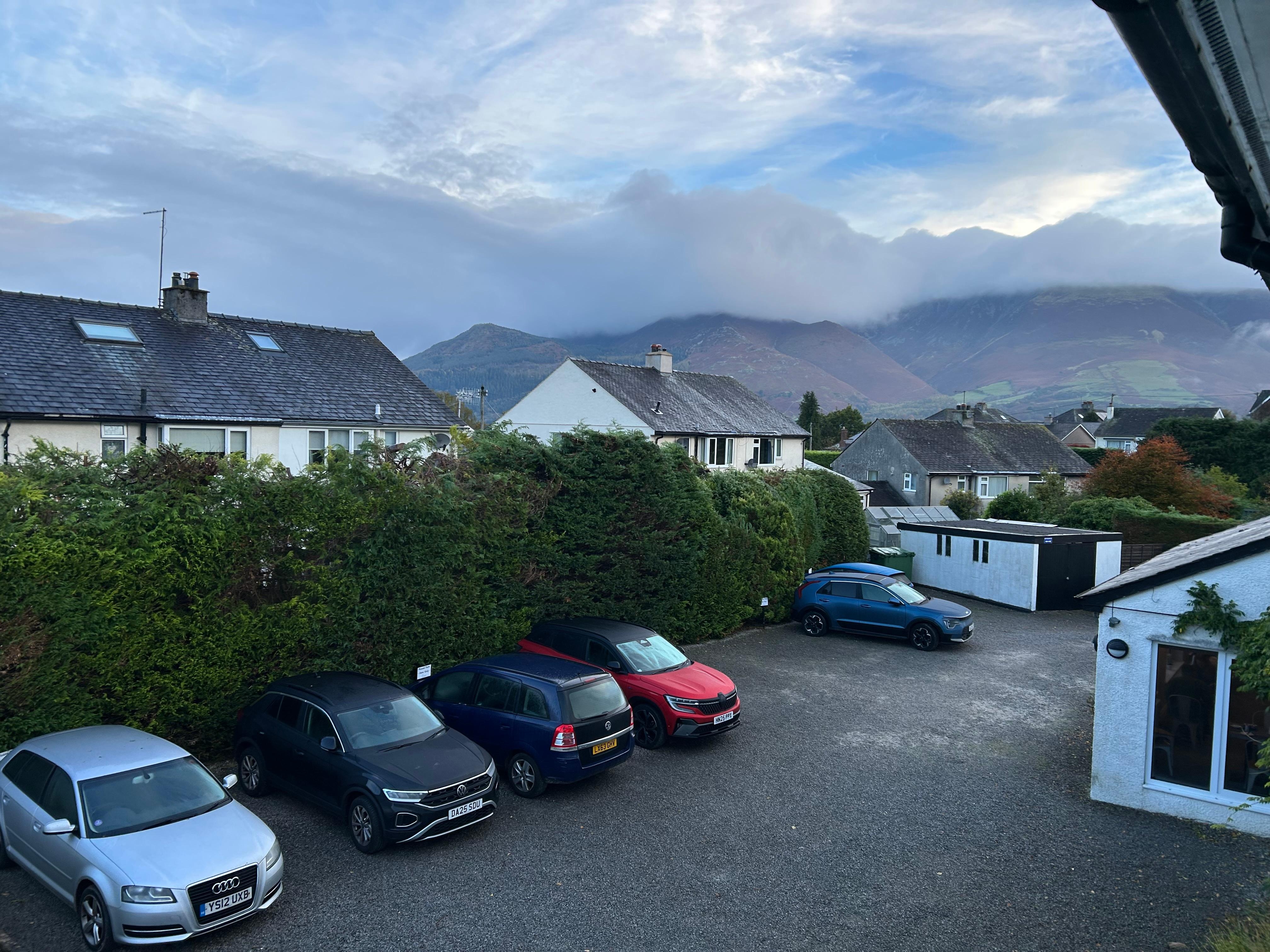 From bedroom window showing parking