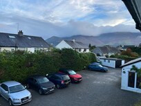 From bedroom window showing parking