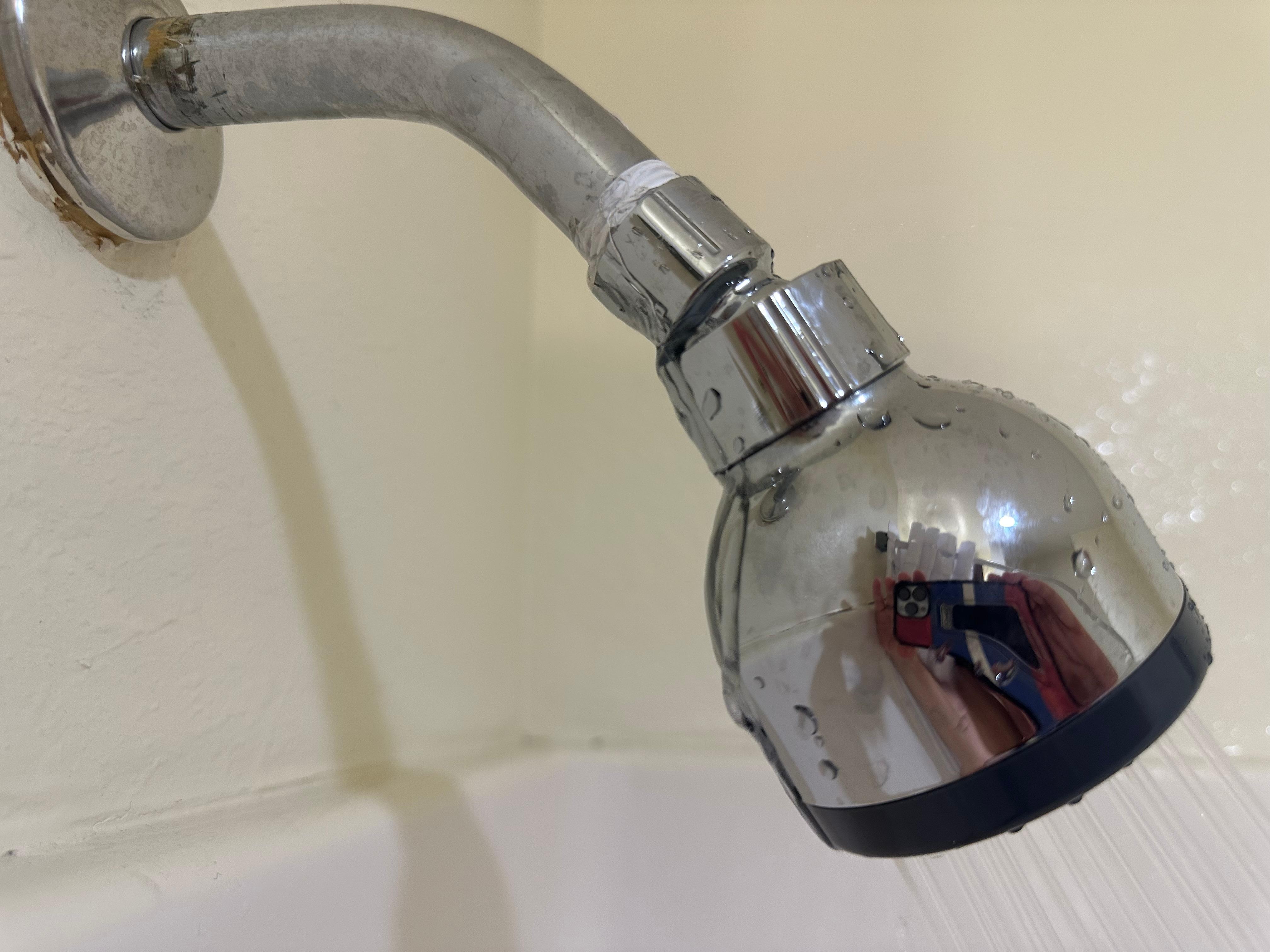 Shower head leaking, poor job with the plumbers tape…