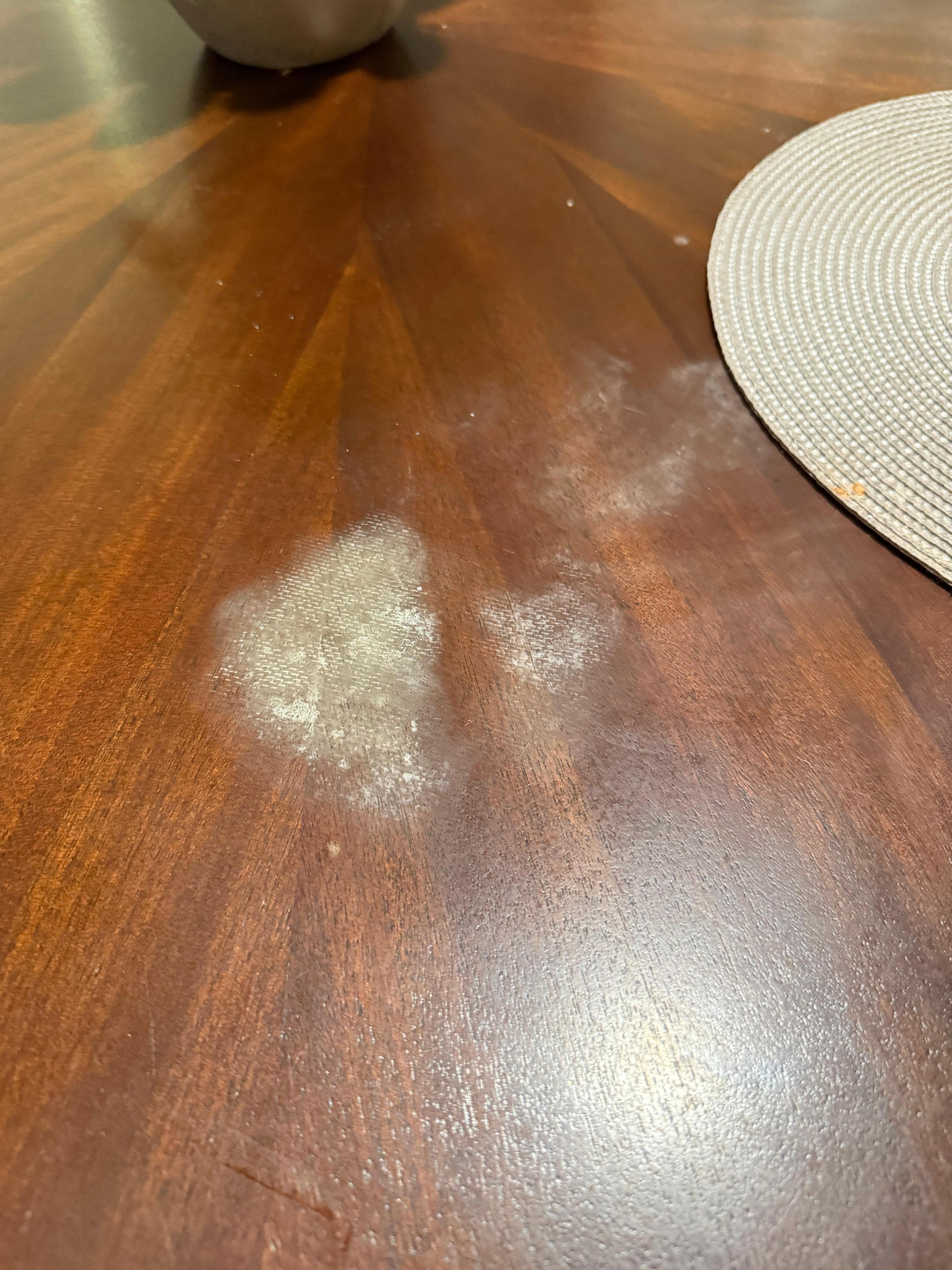 Heat stains in table from previous guests