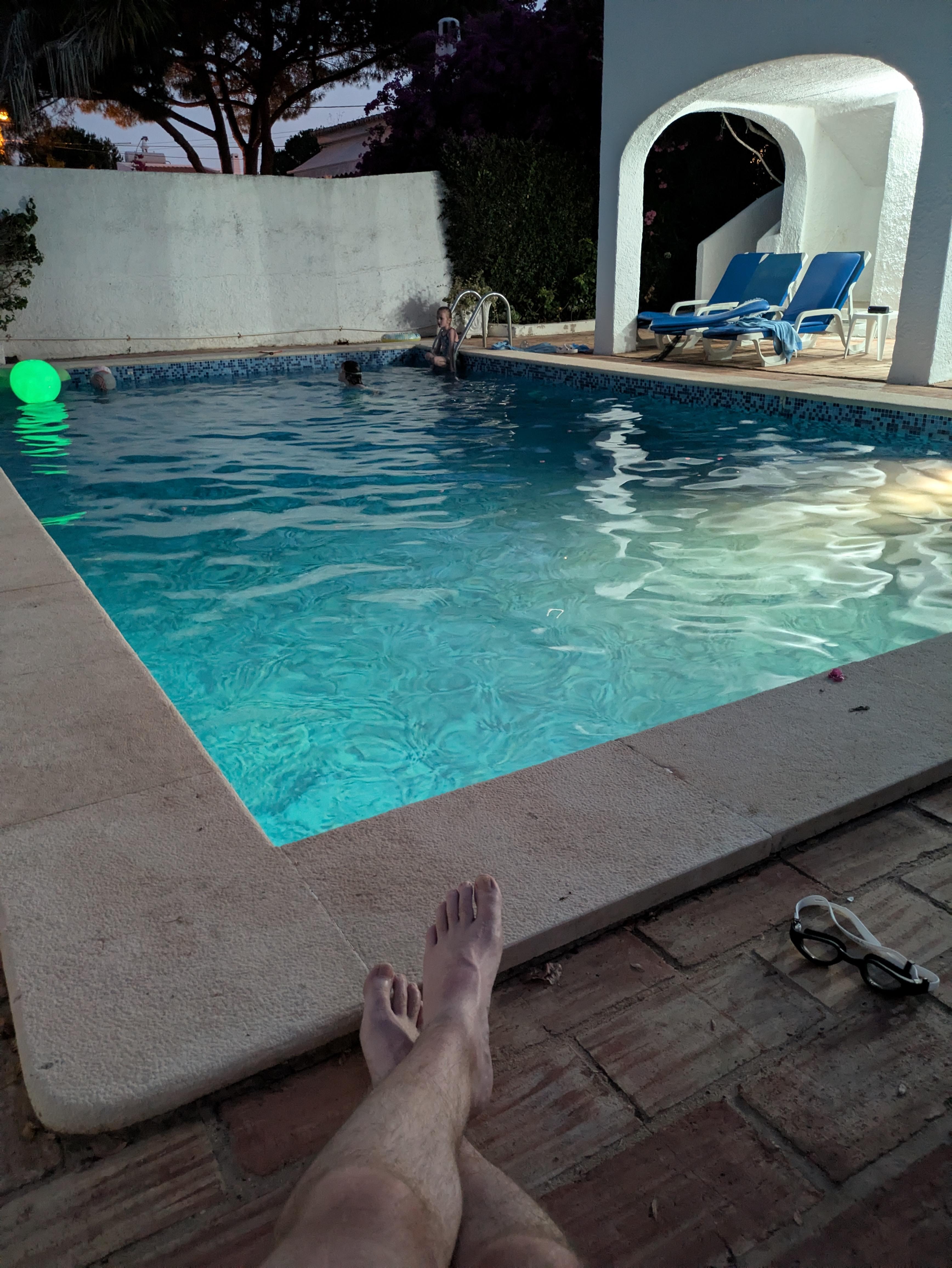 Late night relaxing by the pool