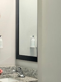 Black stains on mirror