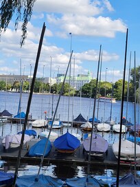 View of the lake and green roofed building in background is the hotel