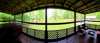 large side screened porch with large hot tub