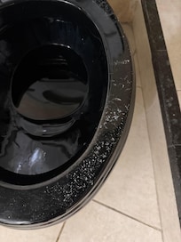 Powdery like substance. It wasn’t on the floor, just the rim like it was forgotten about.