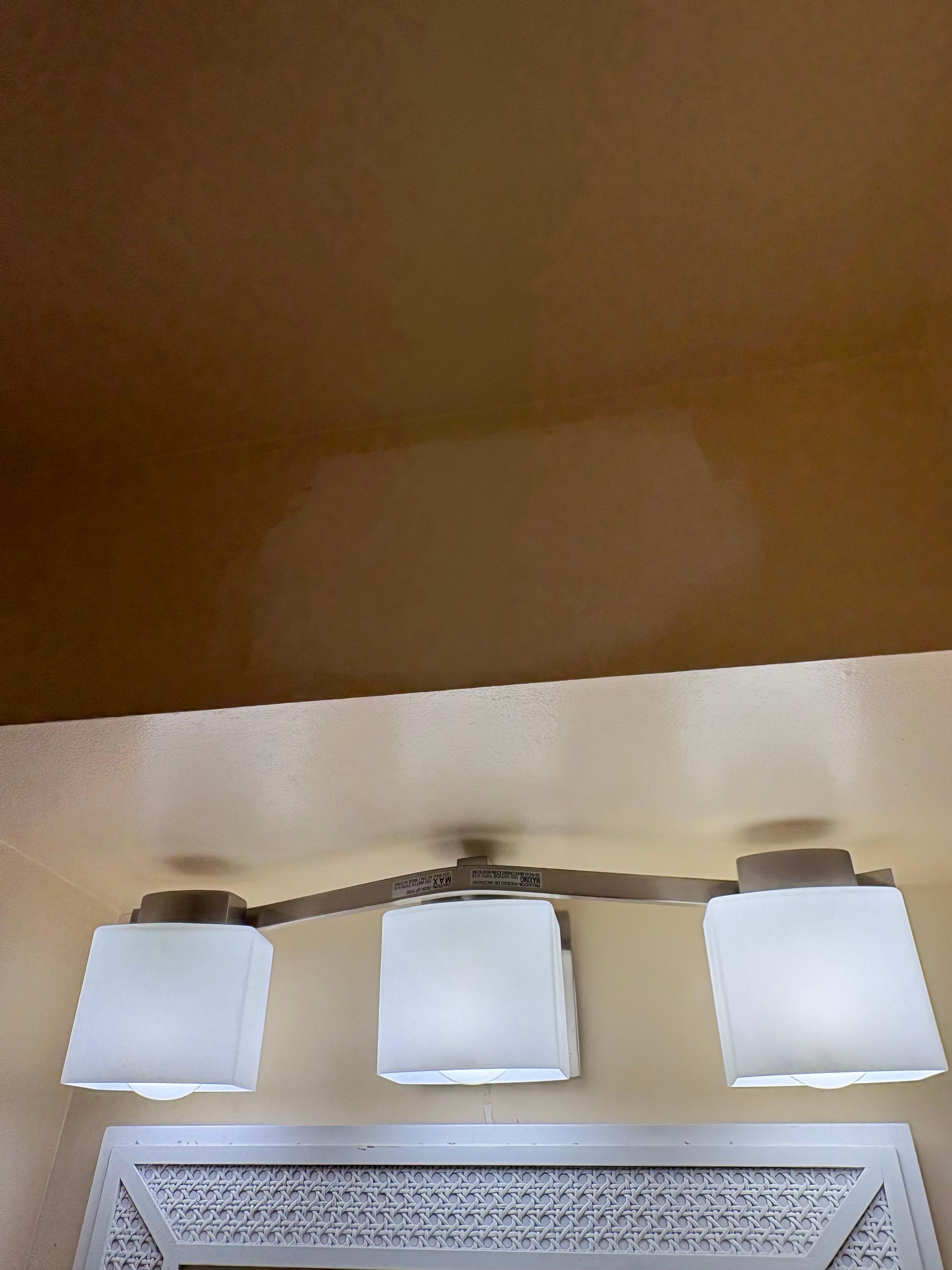 Patched paint over bathroom lights (and bathroom was tiny and dismal water pressure!)