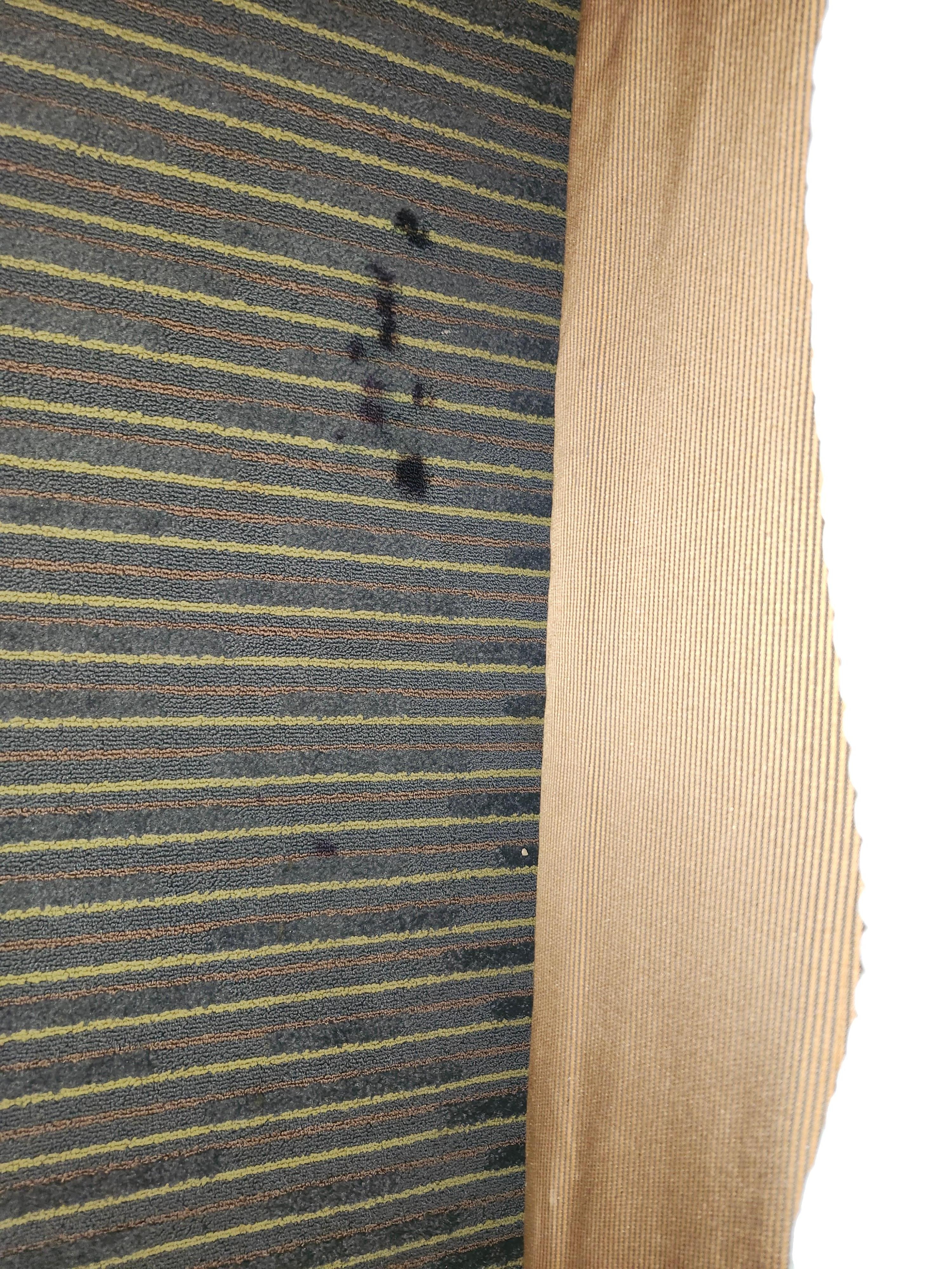 Carpet where you place your feet if sitting on a queen bed