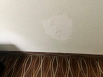 Huge hole in the wall that was patched by a Kindergartener.