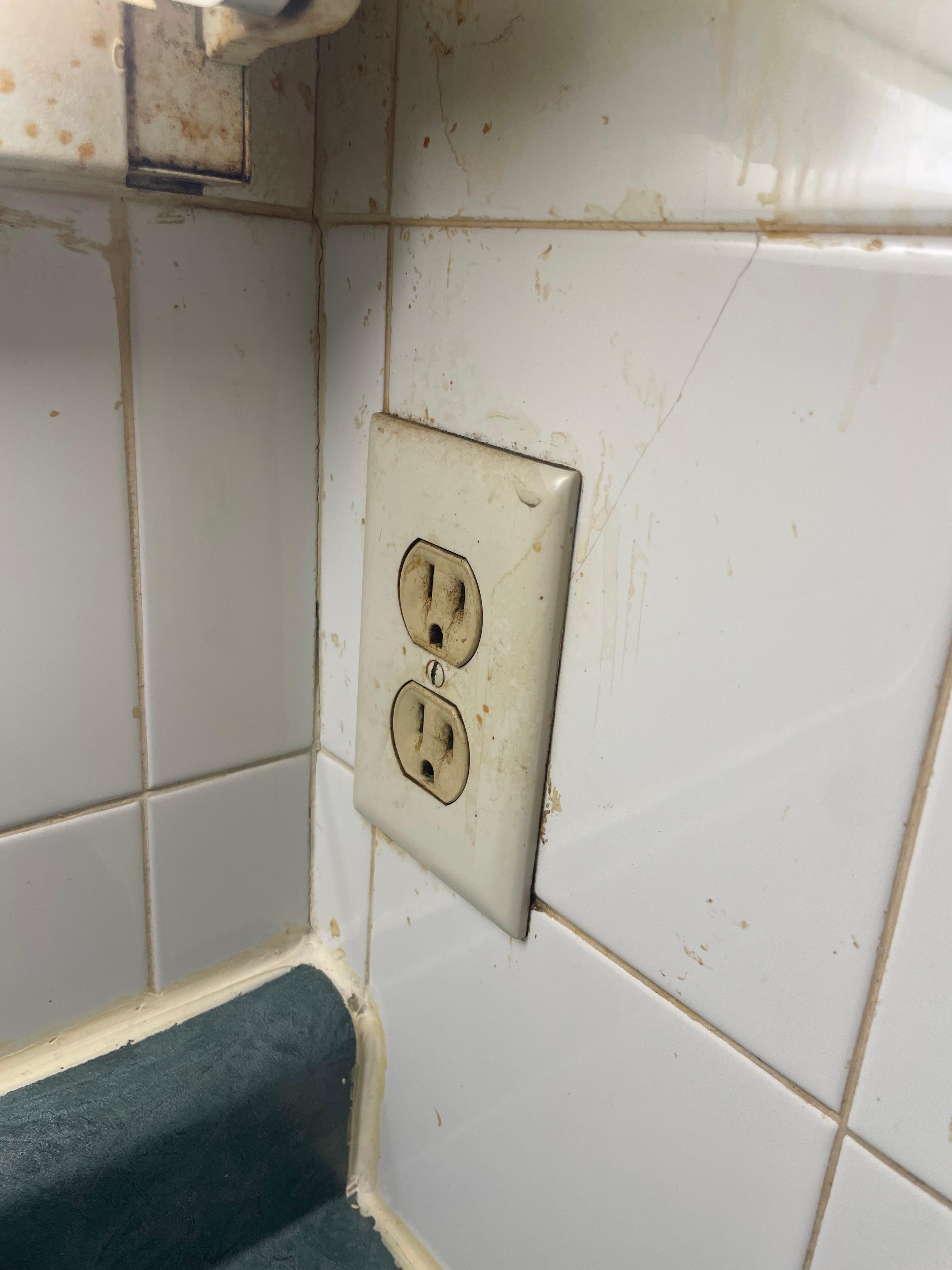 Covered in dirt beside the sink 