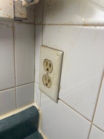 Covered in dirt beside the sink