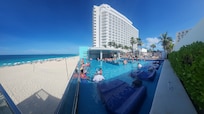 The resort from the swim up bar pool area