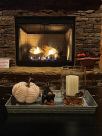 Me enjoying a fire and movie while watching and listening to my family play pool