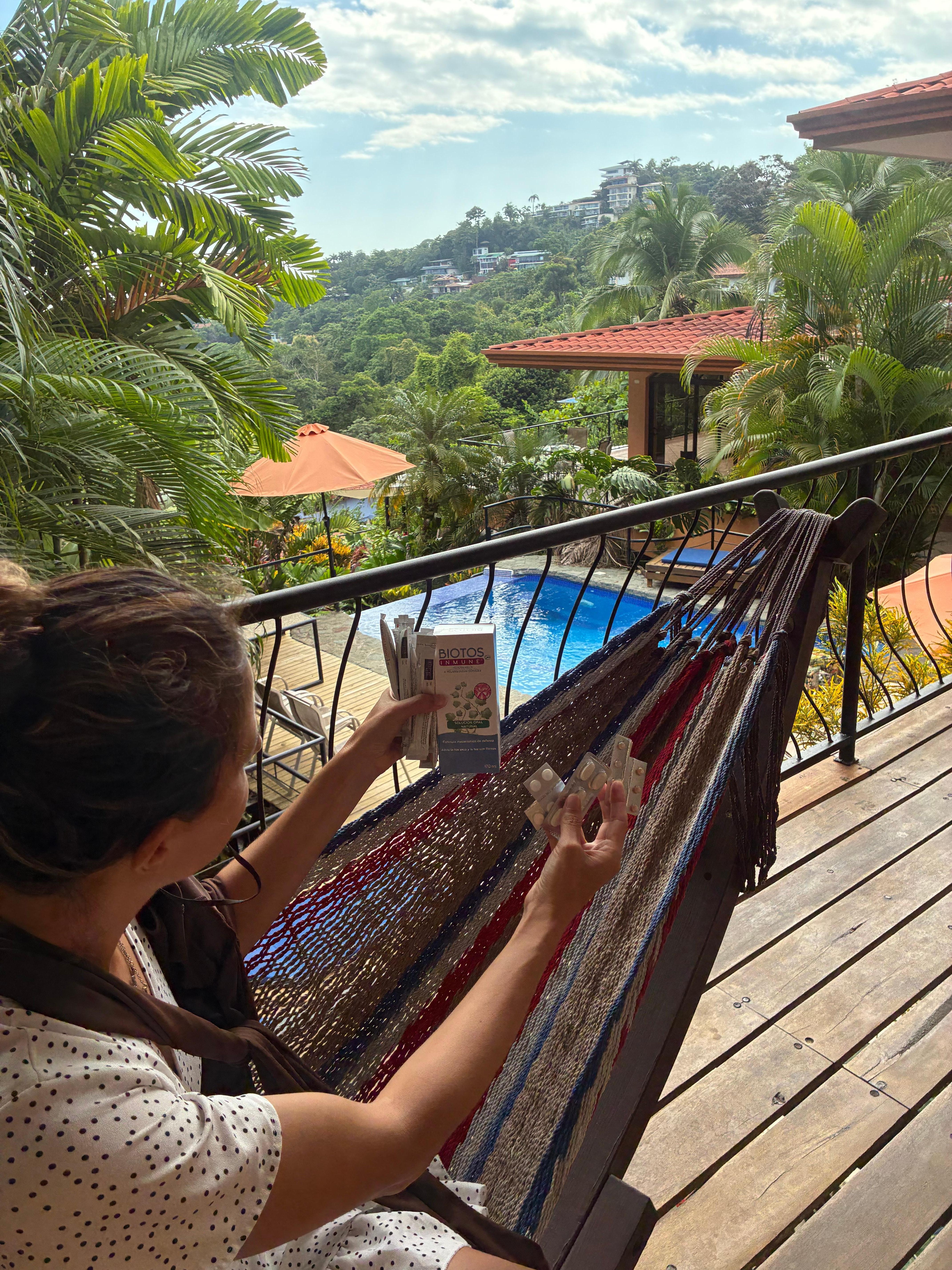 In a hammock looking over the sea on a sunny afternoon