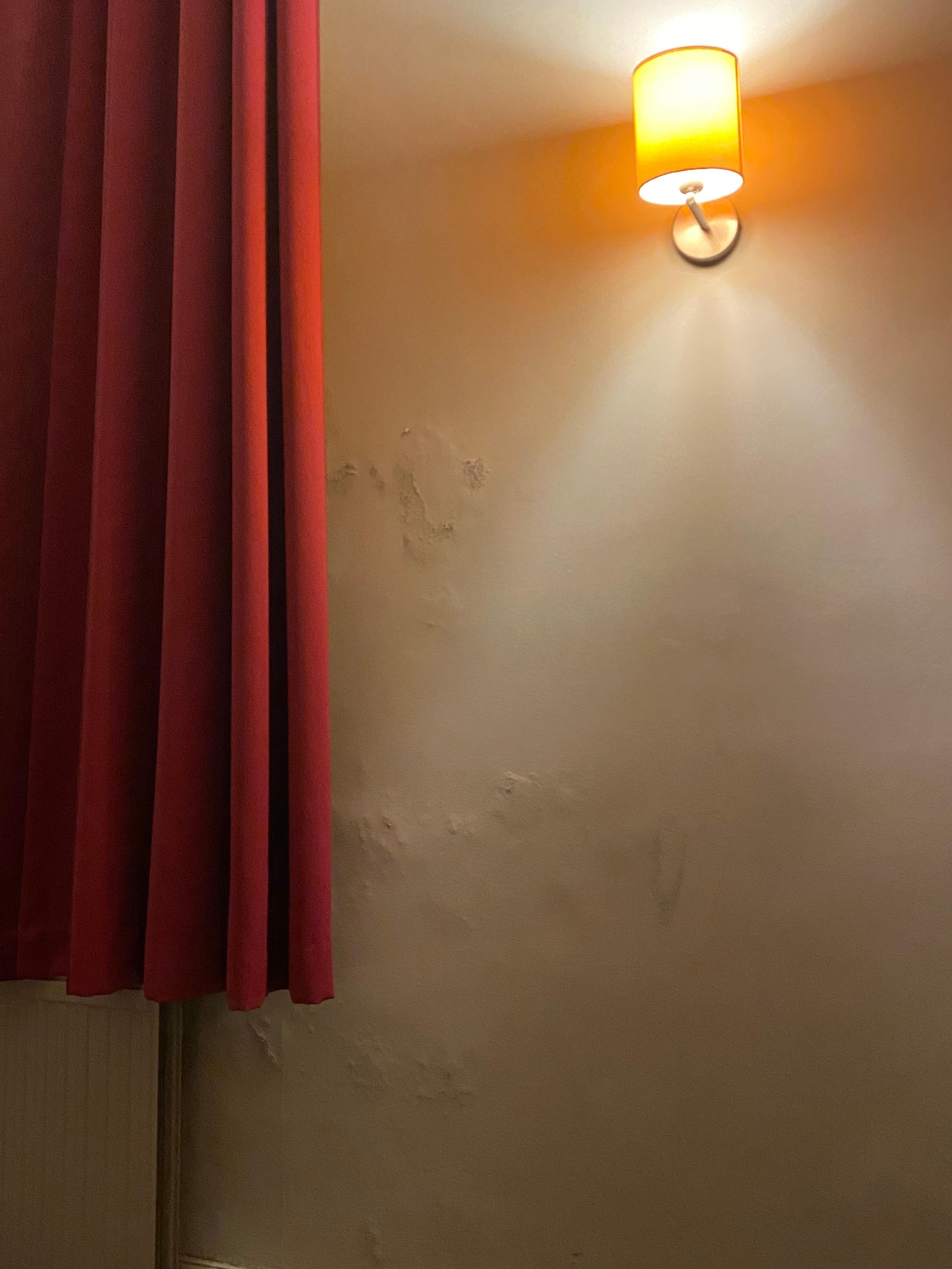 Peeling paint on the walls and ceiling