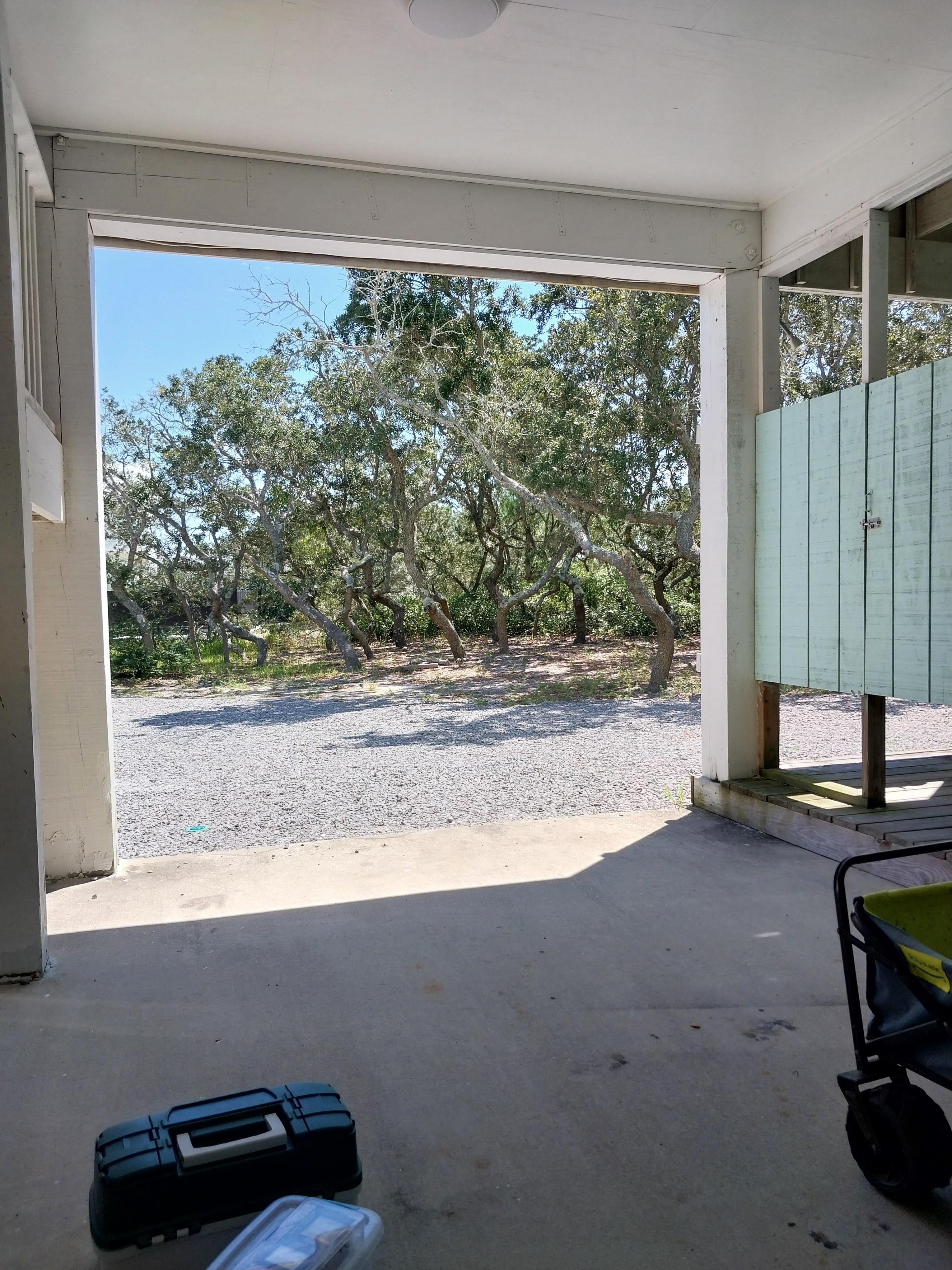Looking from under the carport. Laundry and outside shower there as well
