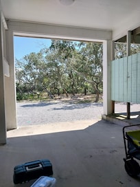 Looking from under the carport. Laundry and outside shower there as well
