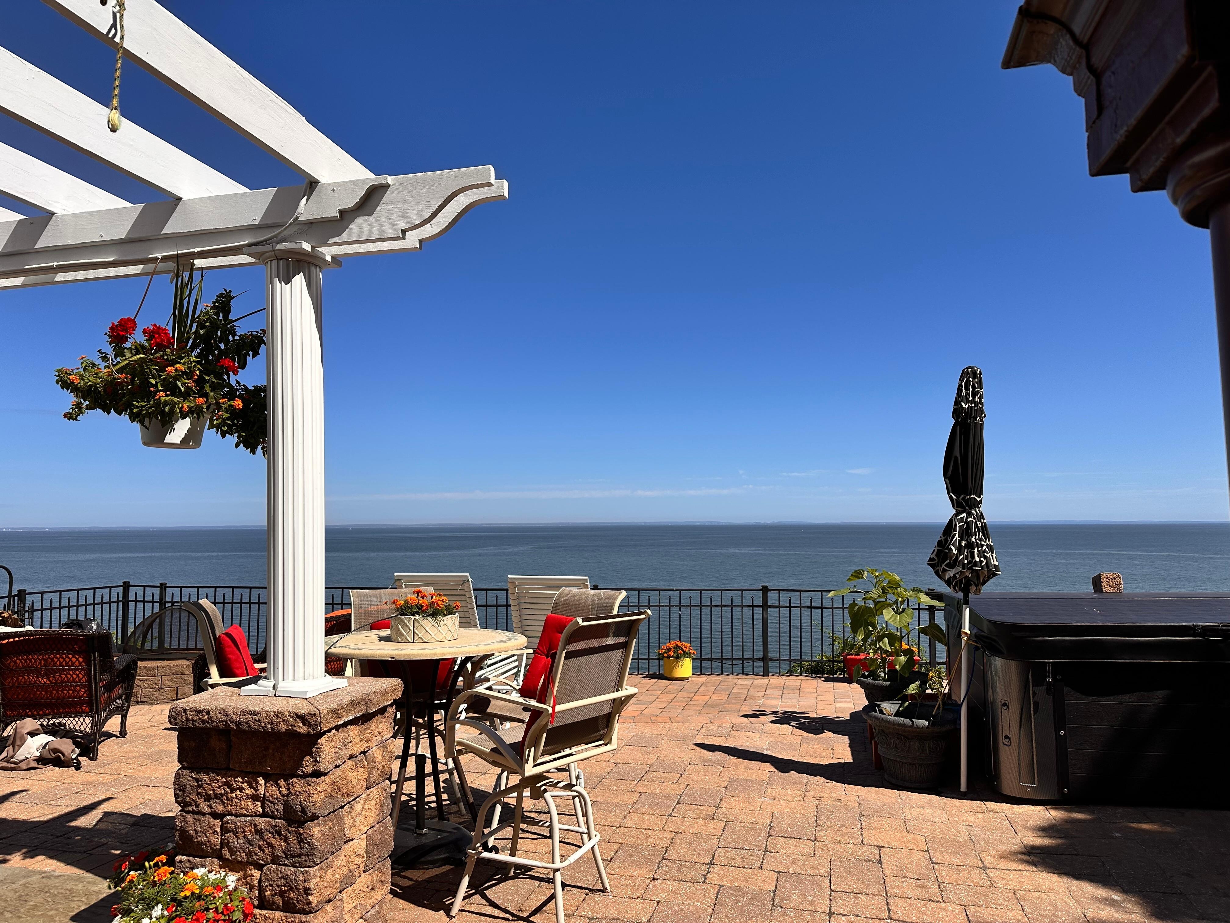 Spacious outdoor patio with multiple seating areas.