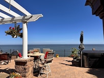 Spacious outdoor patio with multiple seating areas.