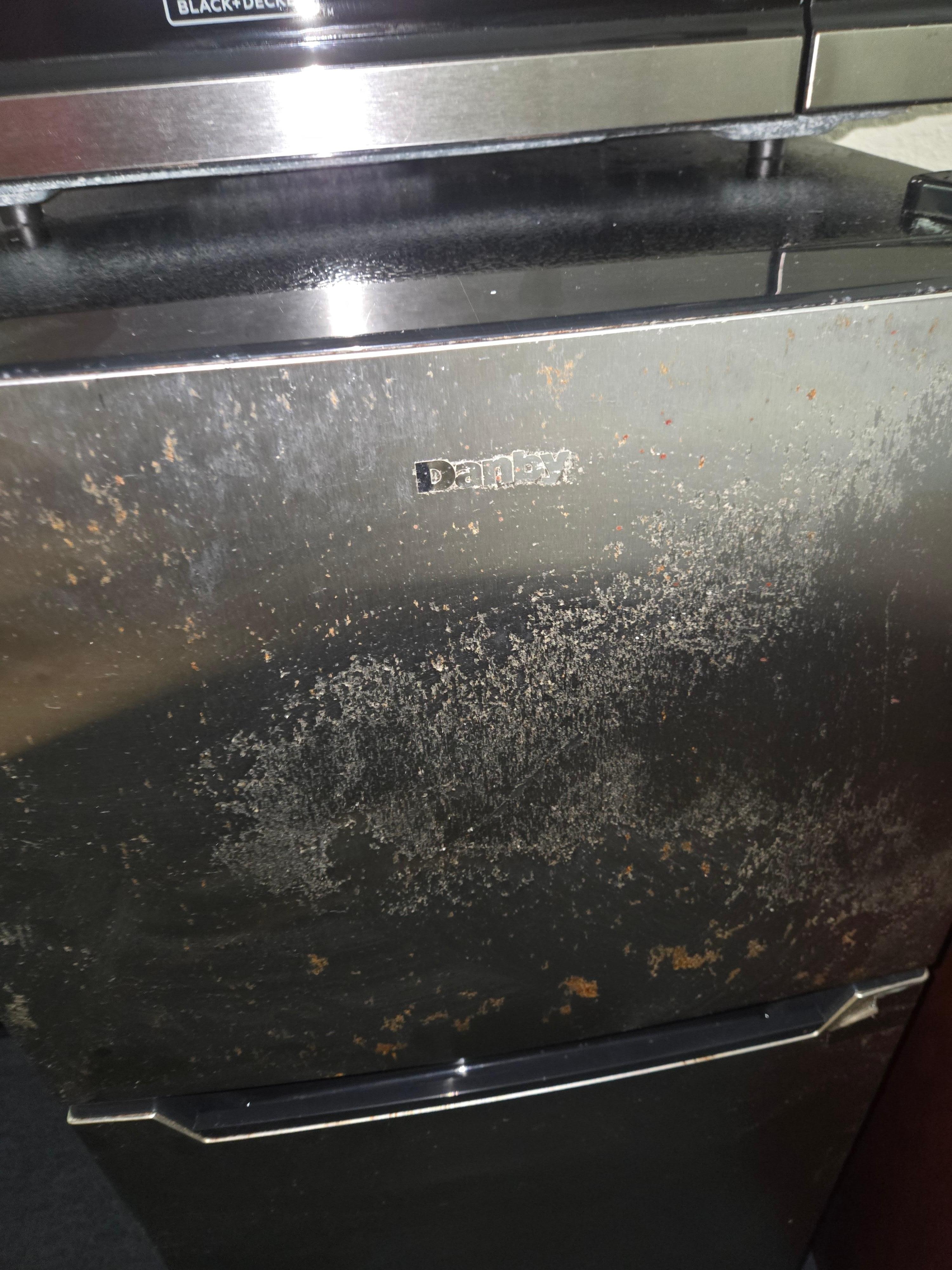 Refrigerator looked nasty and old.