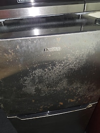 Refrigerator looked nasty and old.