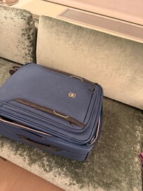 White flecks from hvac vent- I had left my suitcase open and had to shake out all my clothes. It looks like white cigarette ash