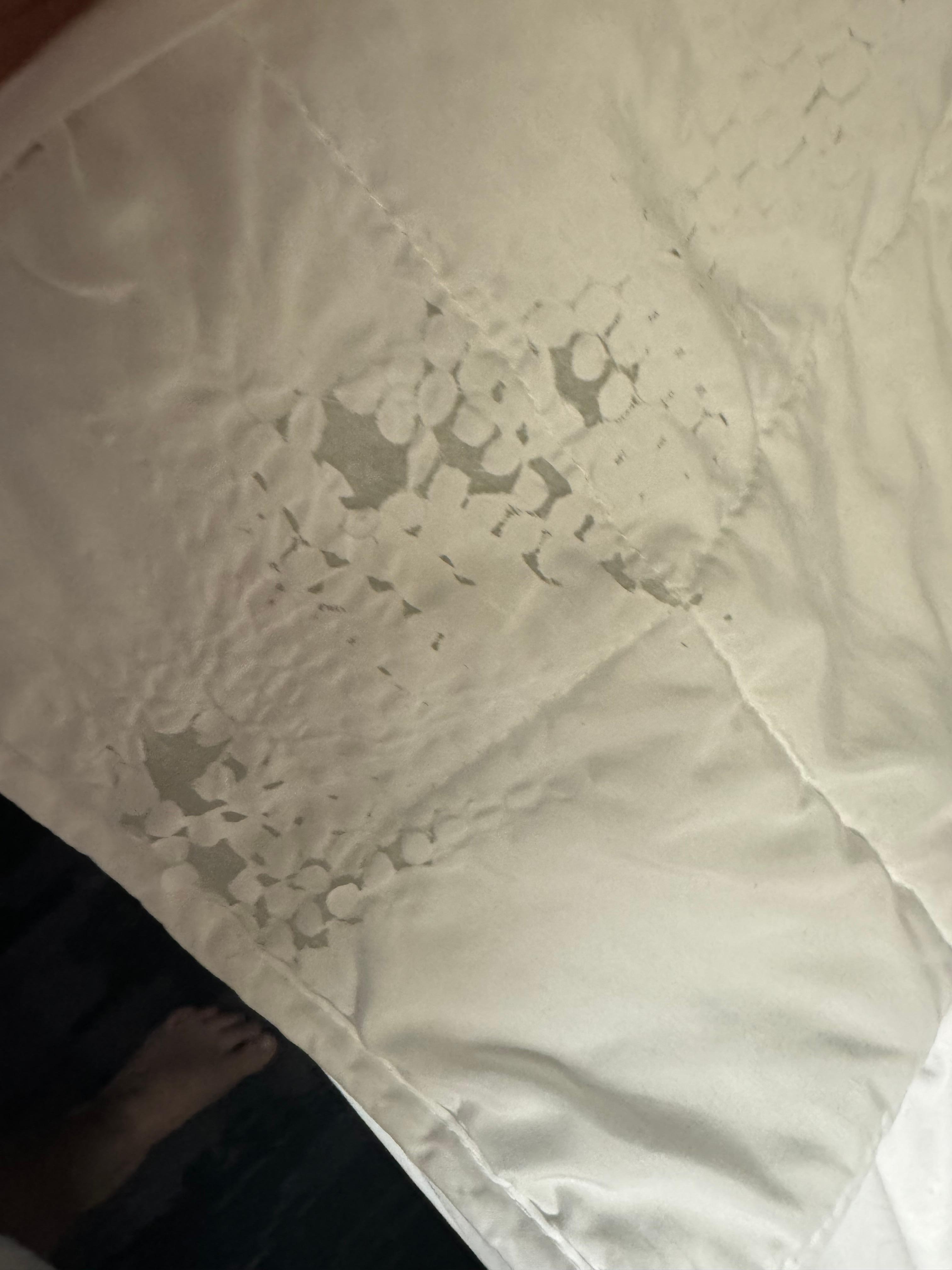 This is one side of the bed and the comforter has holes and felt itchy and like it was plastic 