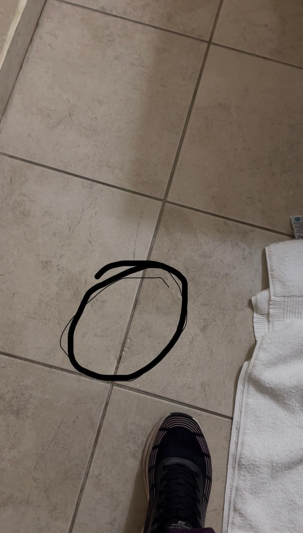 Water spouting from hole in floor by jacuzzi 