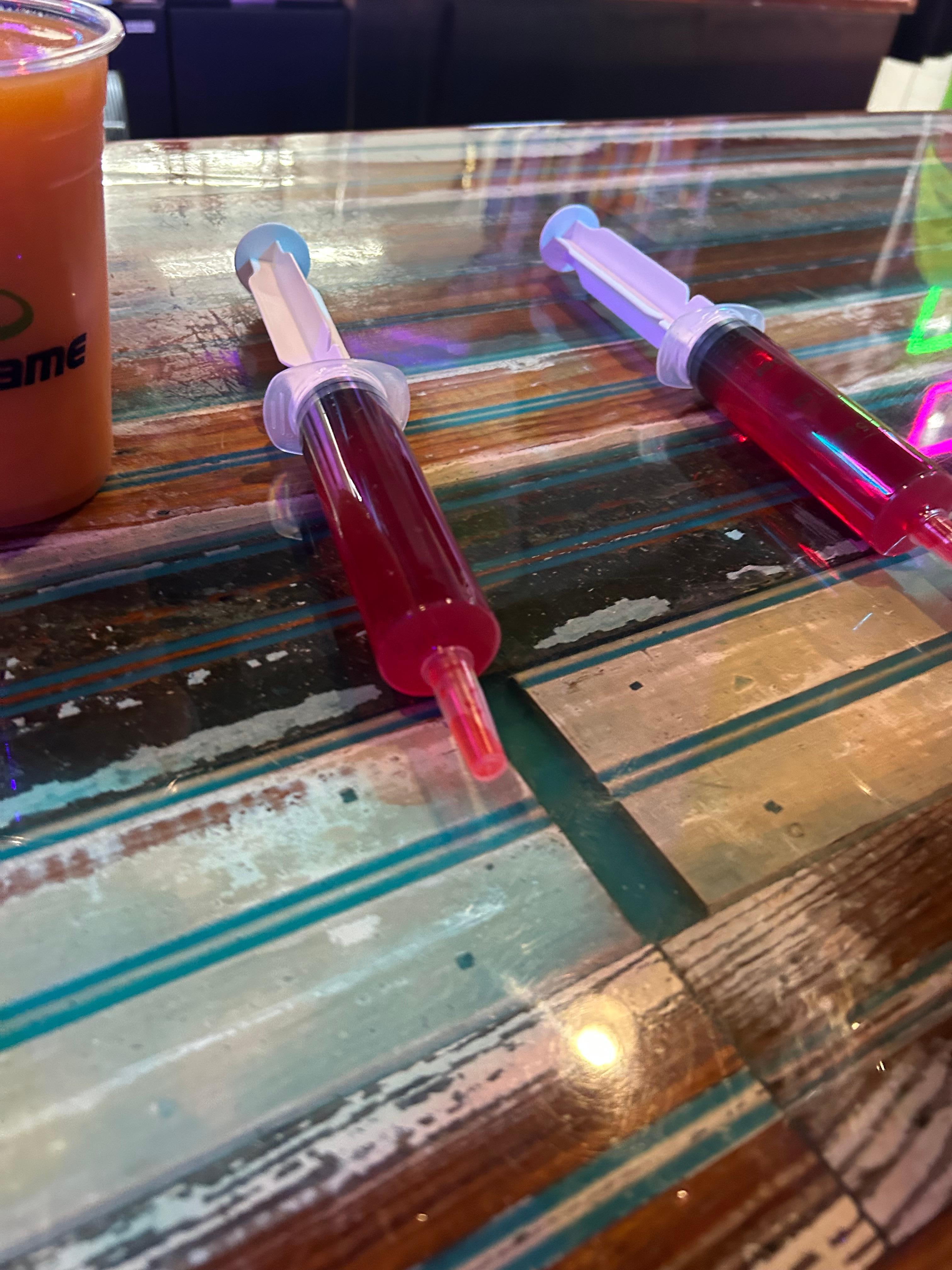 The cheapest drinks at the arcade to the right on Fremont street when you exit the hotel 