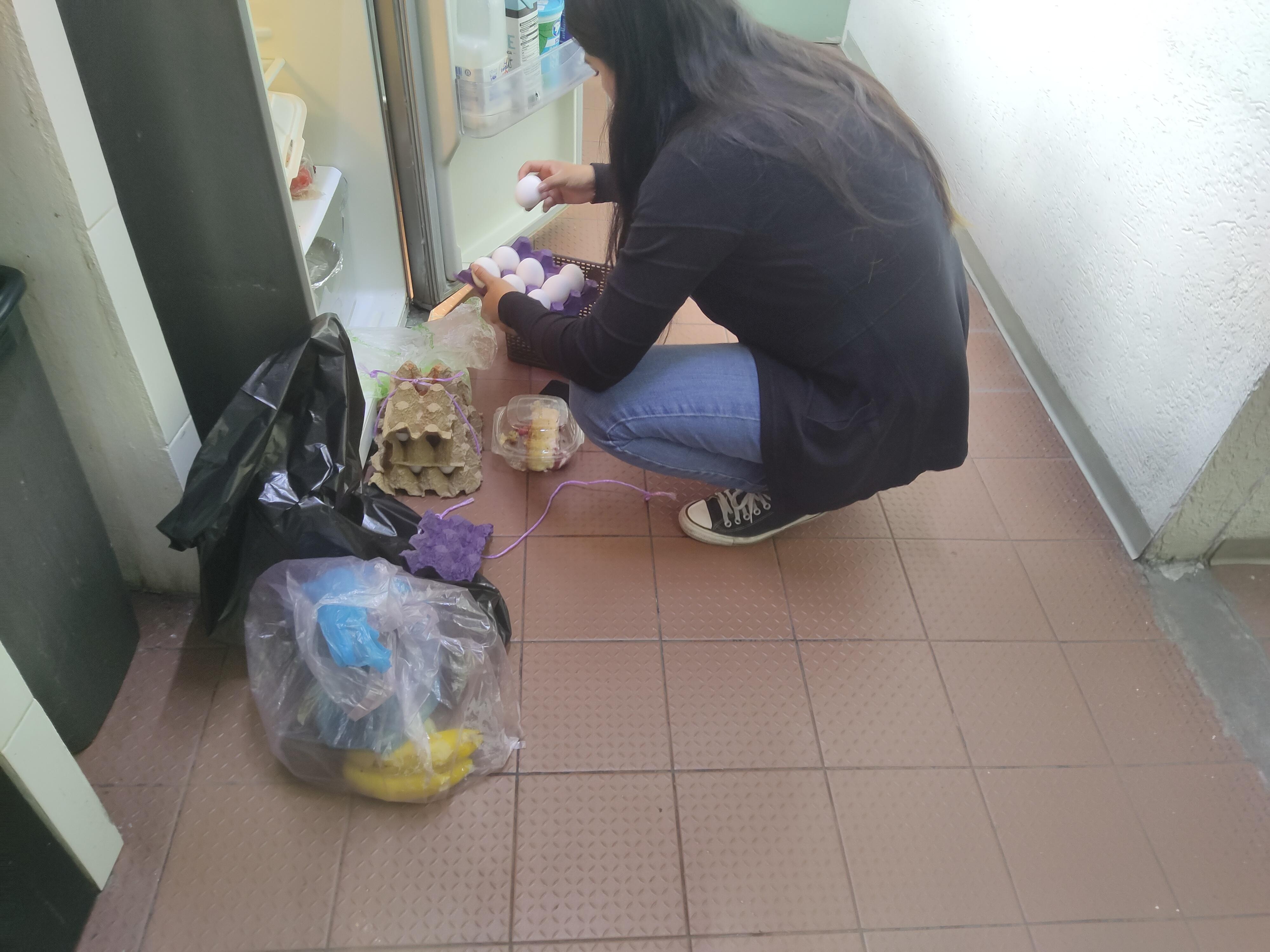 Sadly this is the manager putting everybodies food on the FLOOR!!! Then putting it back in the fridge. 