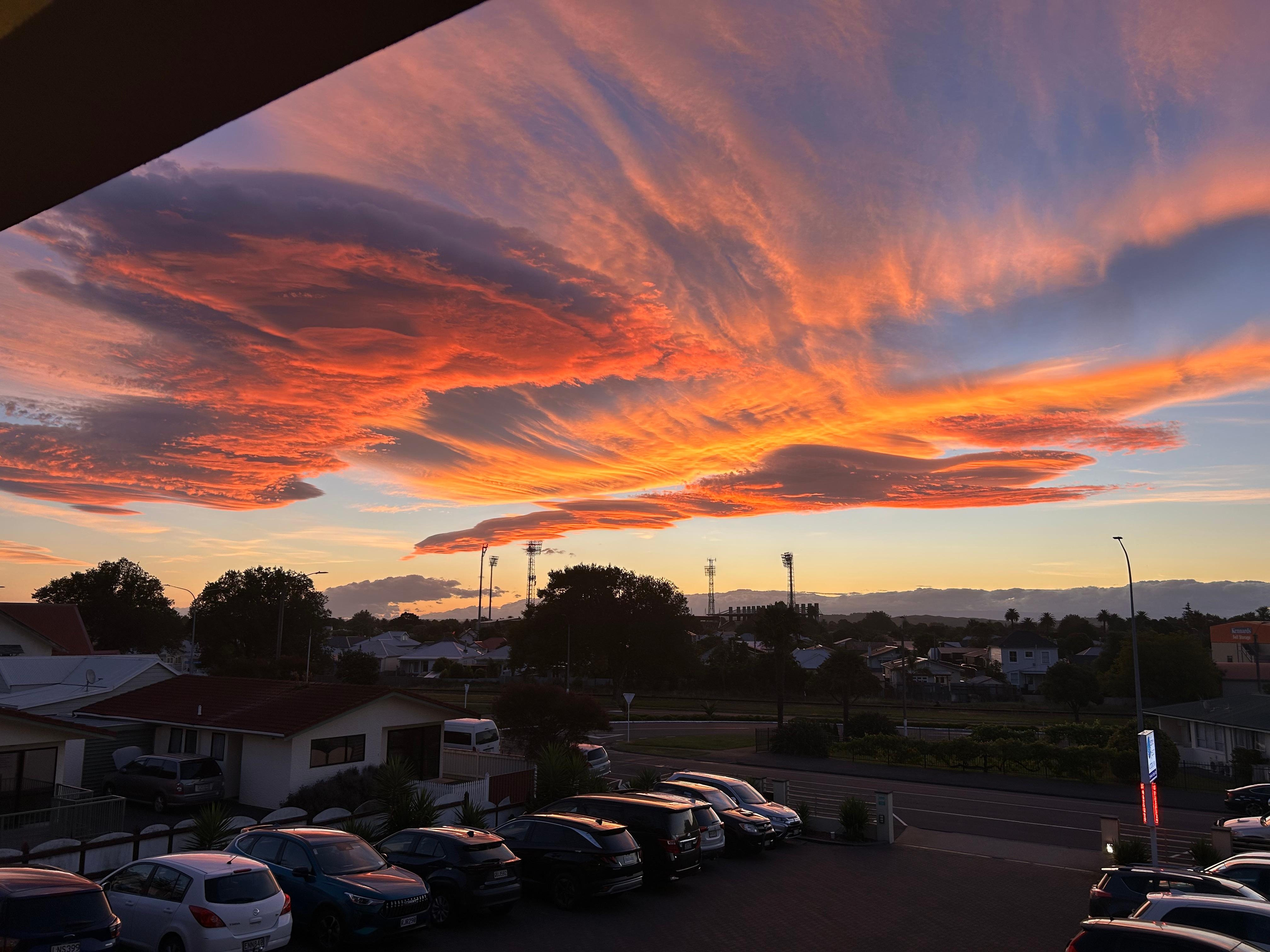 Sunset from the corridor overlooking the parking lot. 