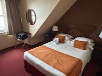 Tiny dated bedroom