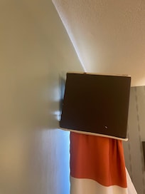 Blinds were hanging from the wall