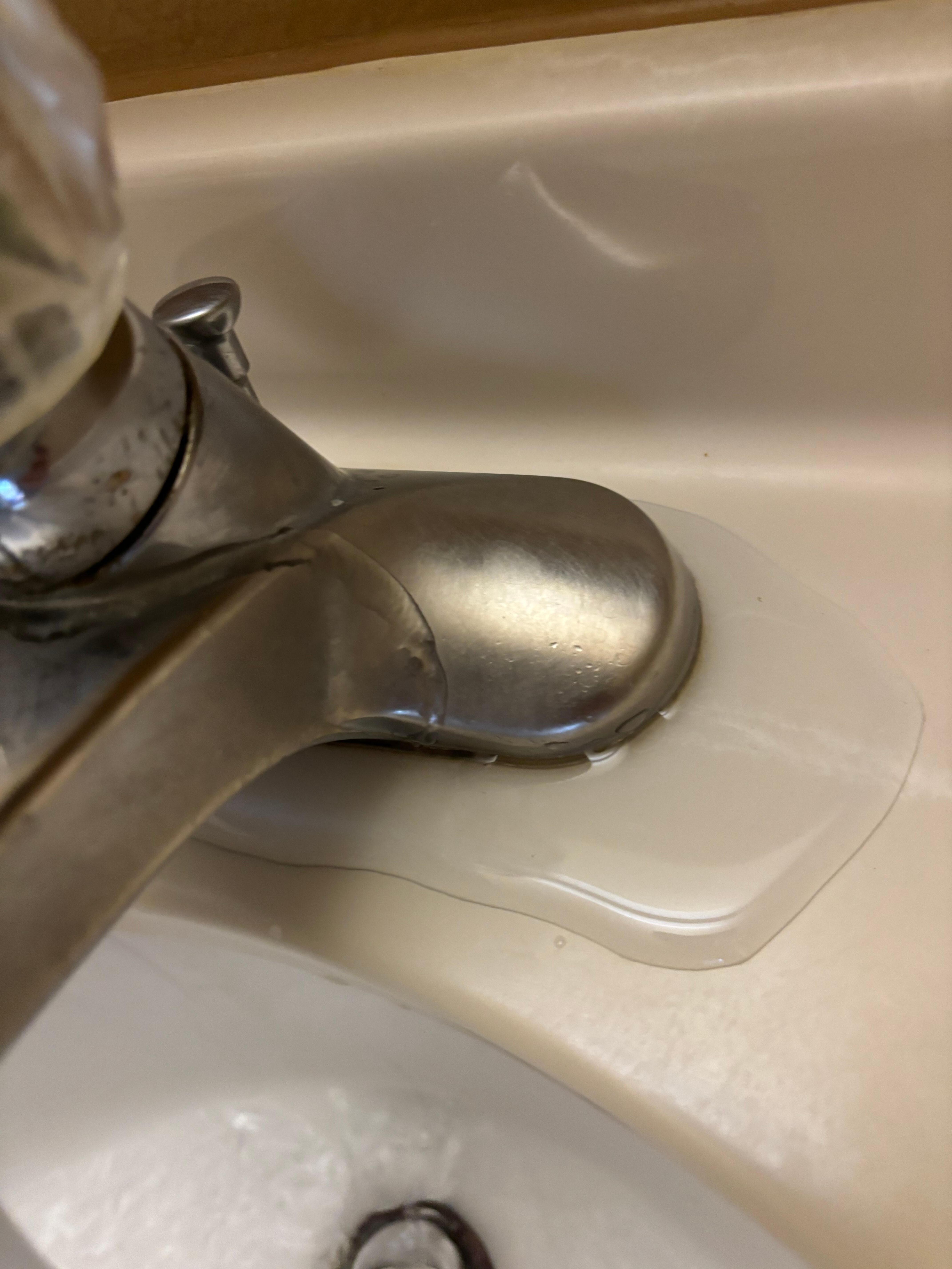 Water running down handle. Pooling on counter. 