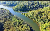 Drone photo taken of river in front of house