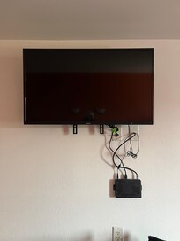 TV mounted as high as the ceiling, all the cords were eye level.