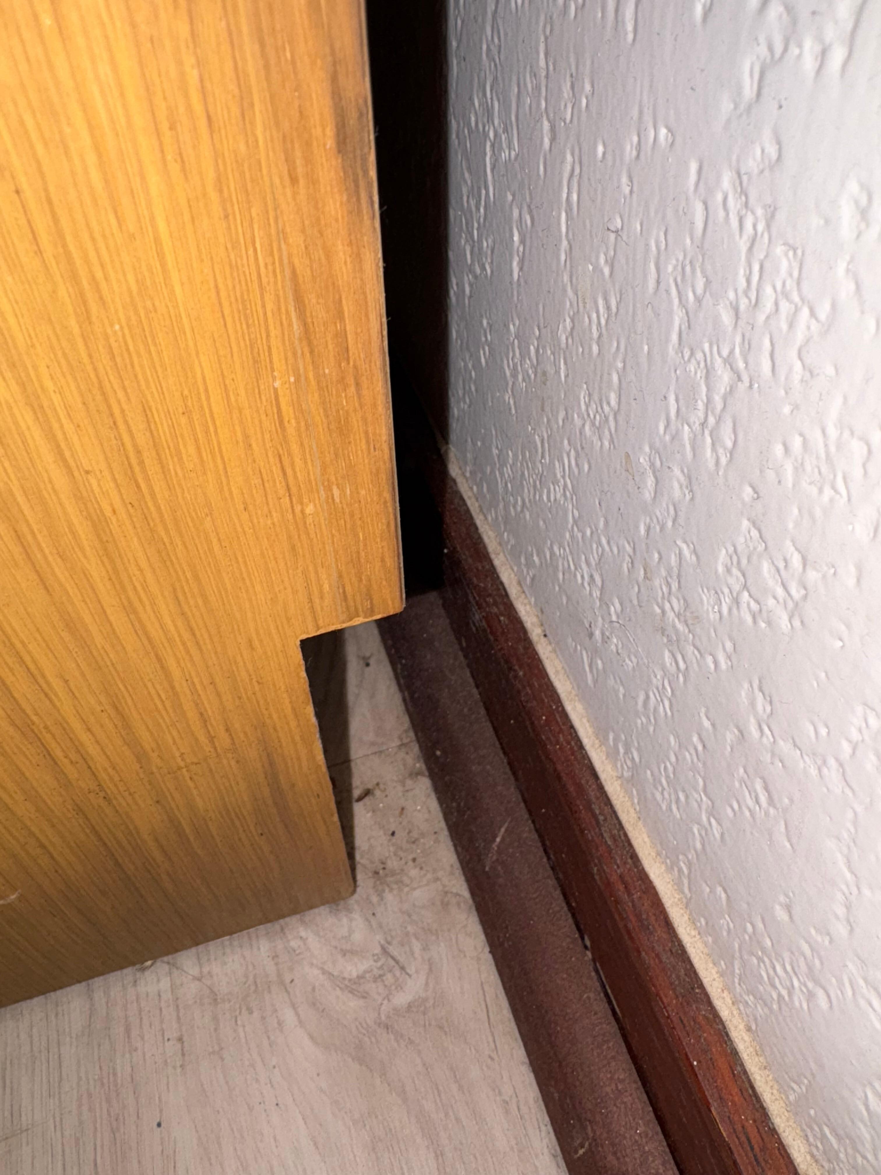 Dirty floors. This was behind dresser, but everywhere was dirty. 