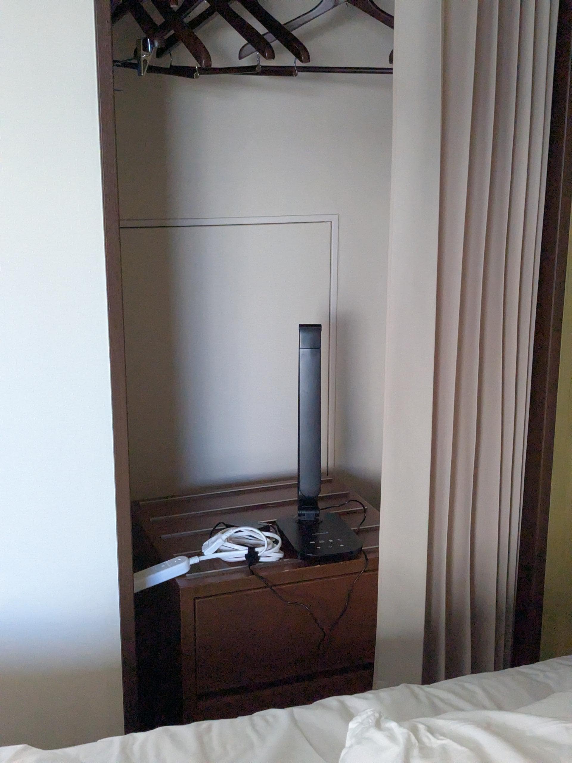  No outlet on one side of the bed, a huge inconvenience when sharing a bed. Space is so limited that the night stand was shoved inside the closet.