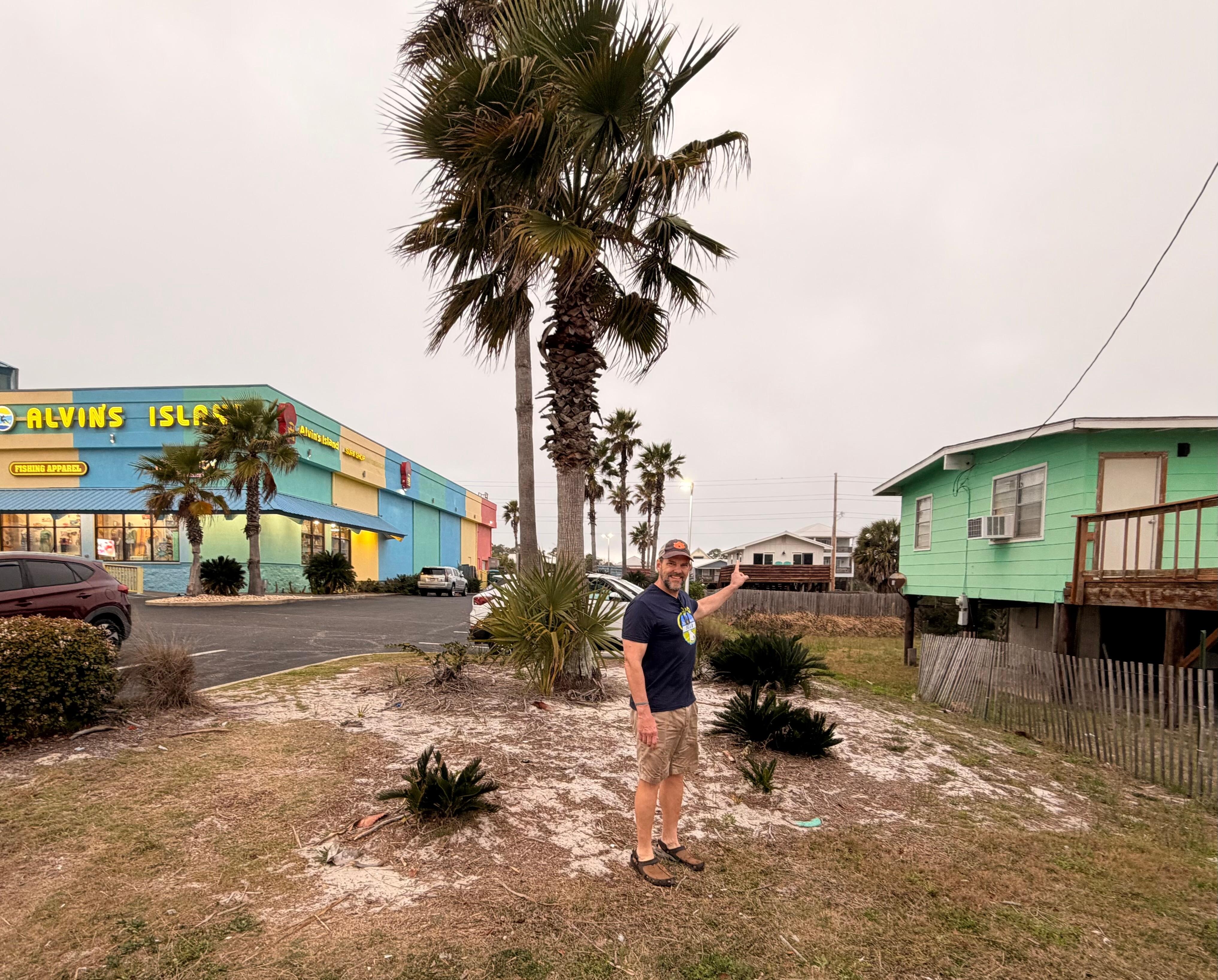 Husband pointing to the house. 