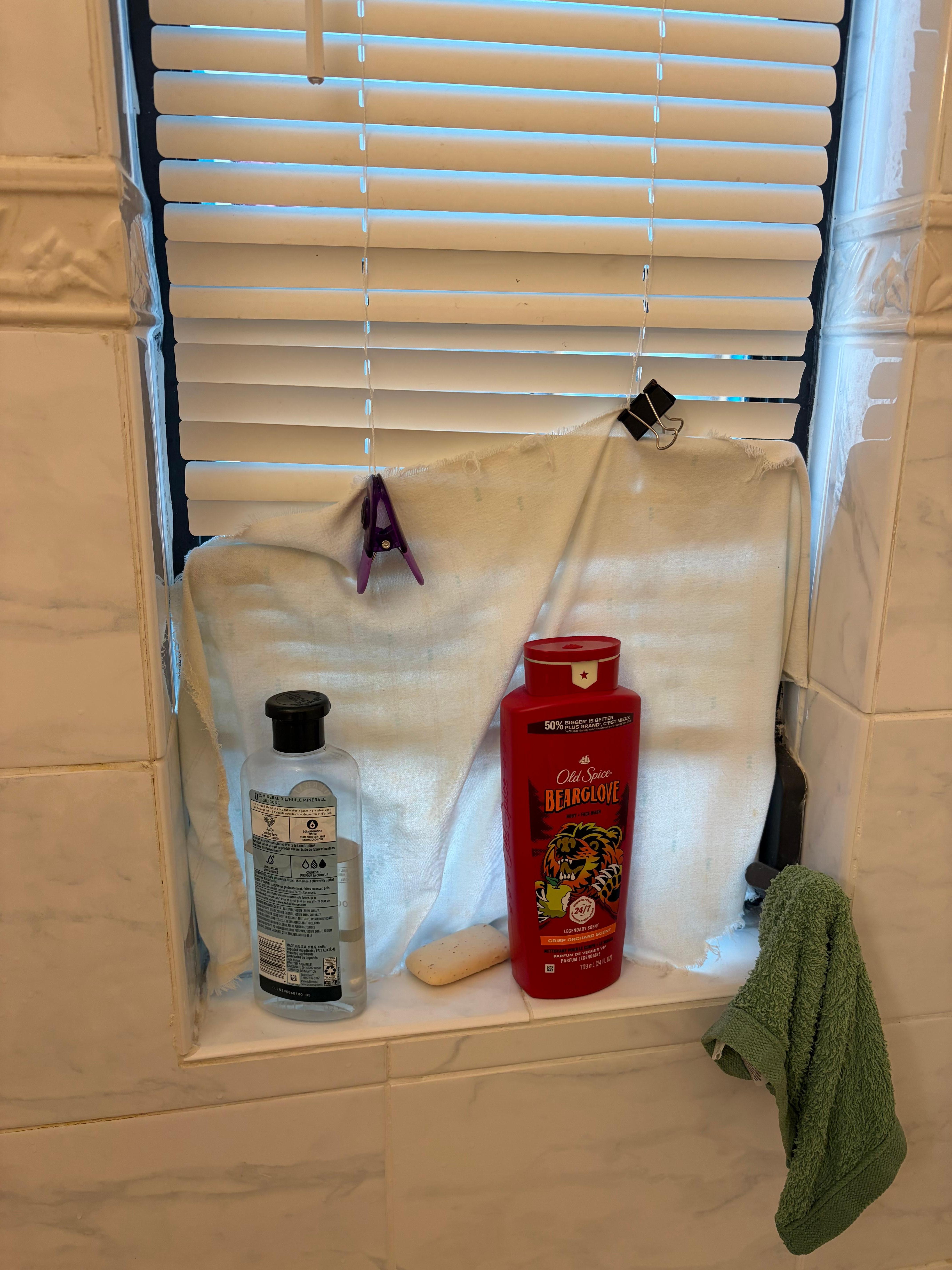 Broken, too short bathroom blind 