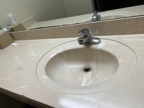 When you turn on the water, more water comes out at the base of the handle then out of the faucet