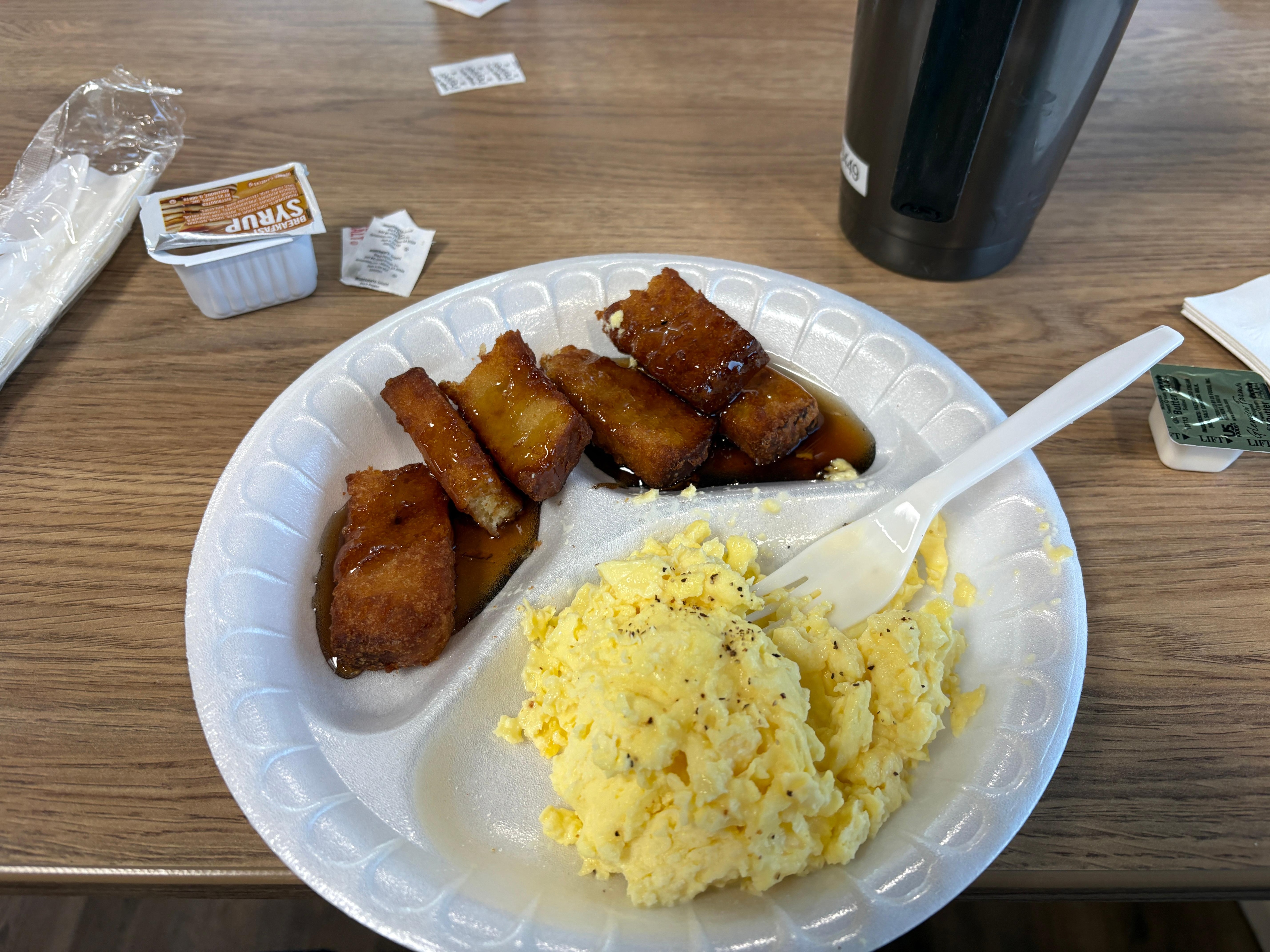 The delicious scrambled eggs, and french toast sticks (cut in half to fit on the plate).