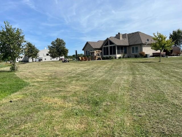 view from beside the pone to the back of the house